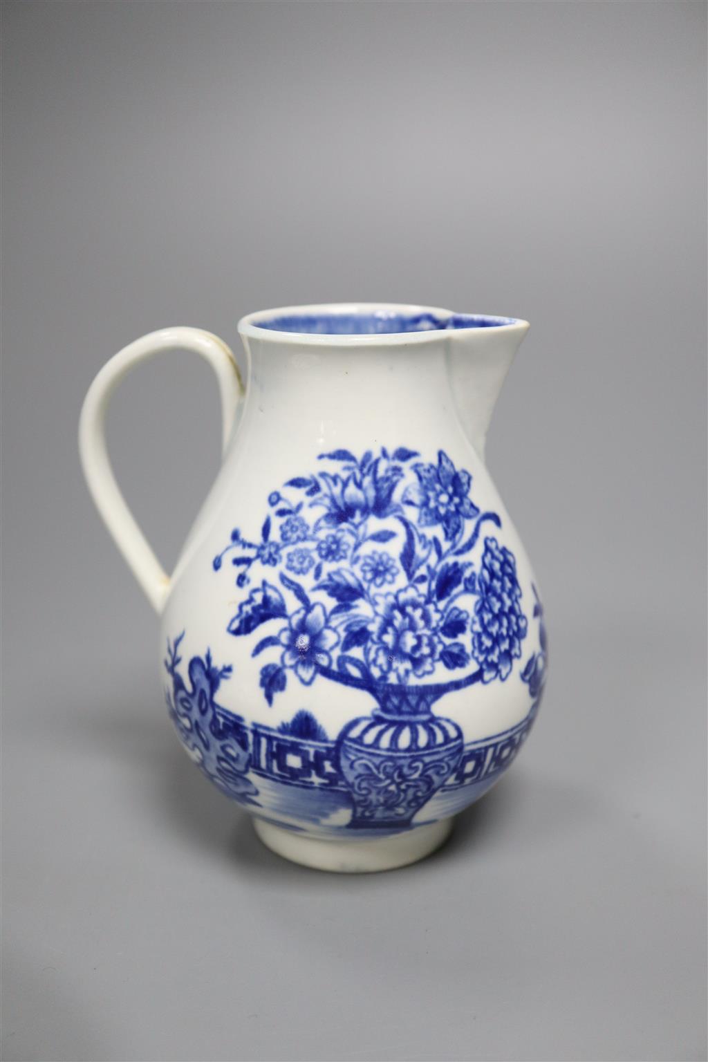 A Worcester Candle Fence tea bowl & saucer, c.1765 and a The Bat sparrow beak milk jug, c.1785,